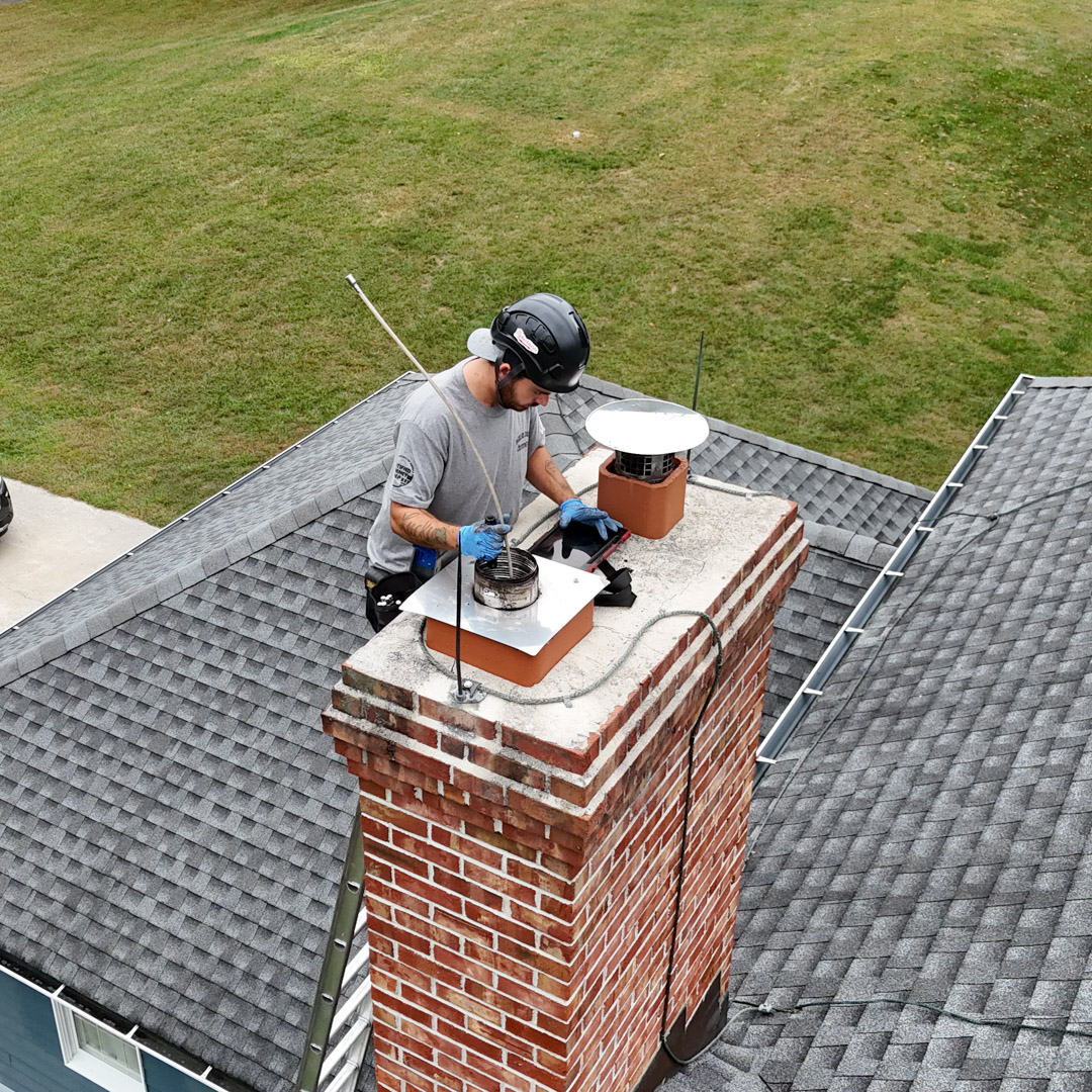 Certified chimney sweep doing an inspection in Trenton, NJ
